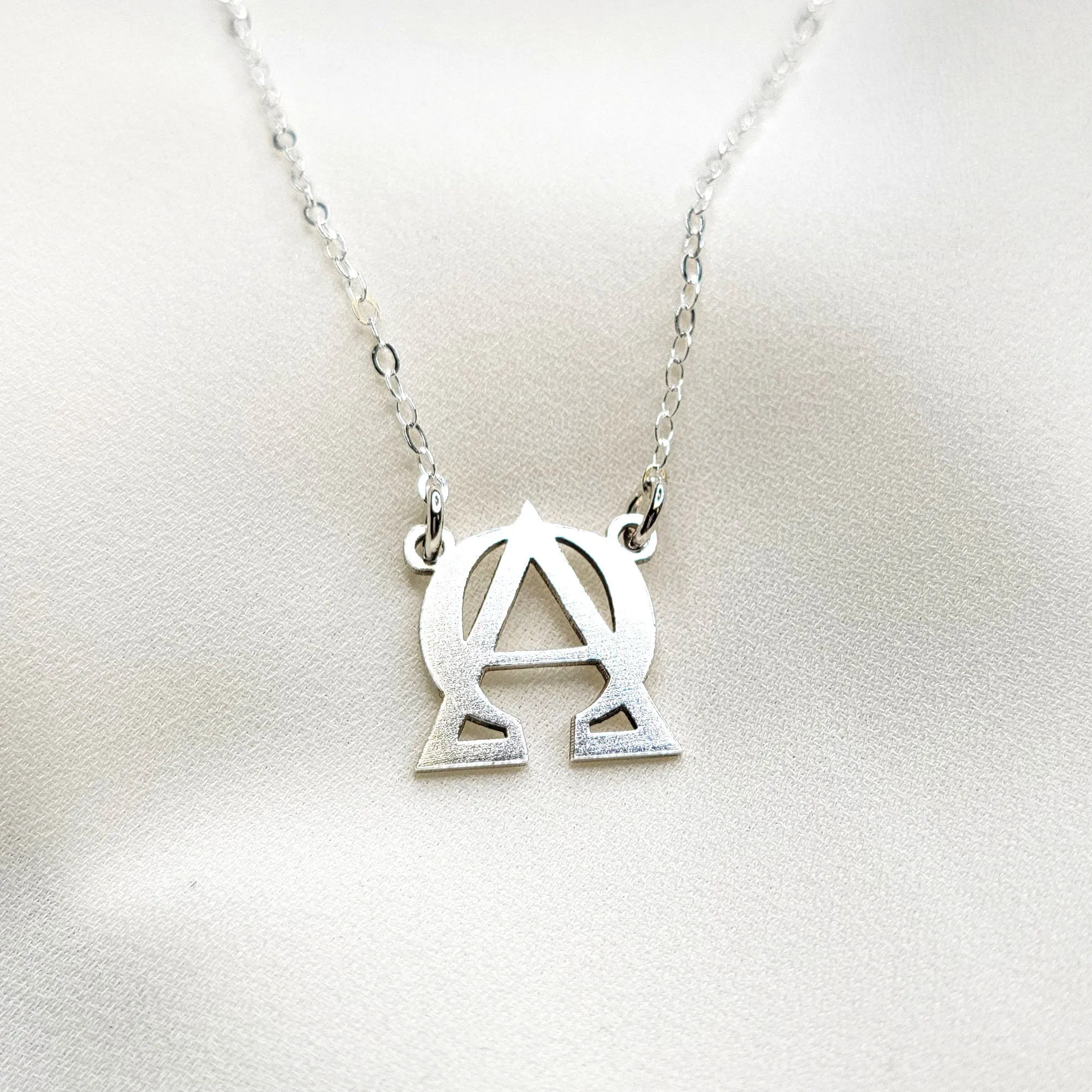 ALPHA and OMEGA symbol necklace - CG447N. Starts at