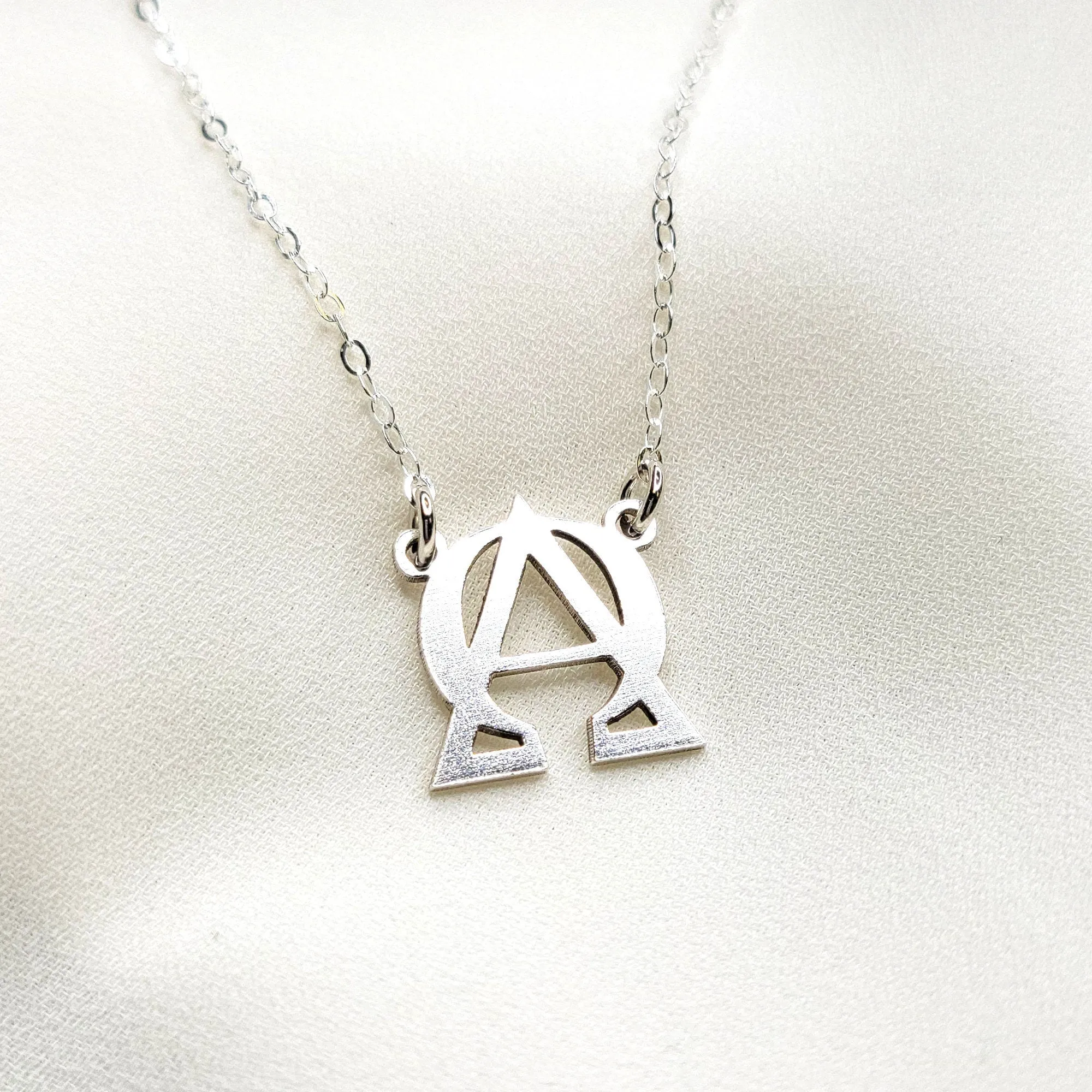 ALPHA and OMEGA symbol necklace - CG447N. Starts at
